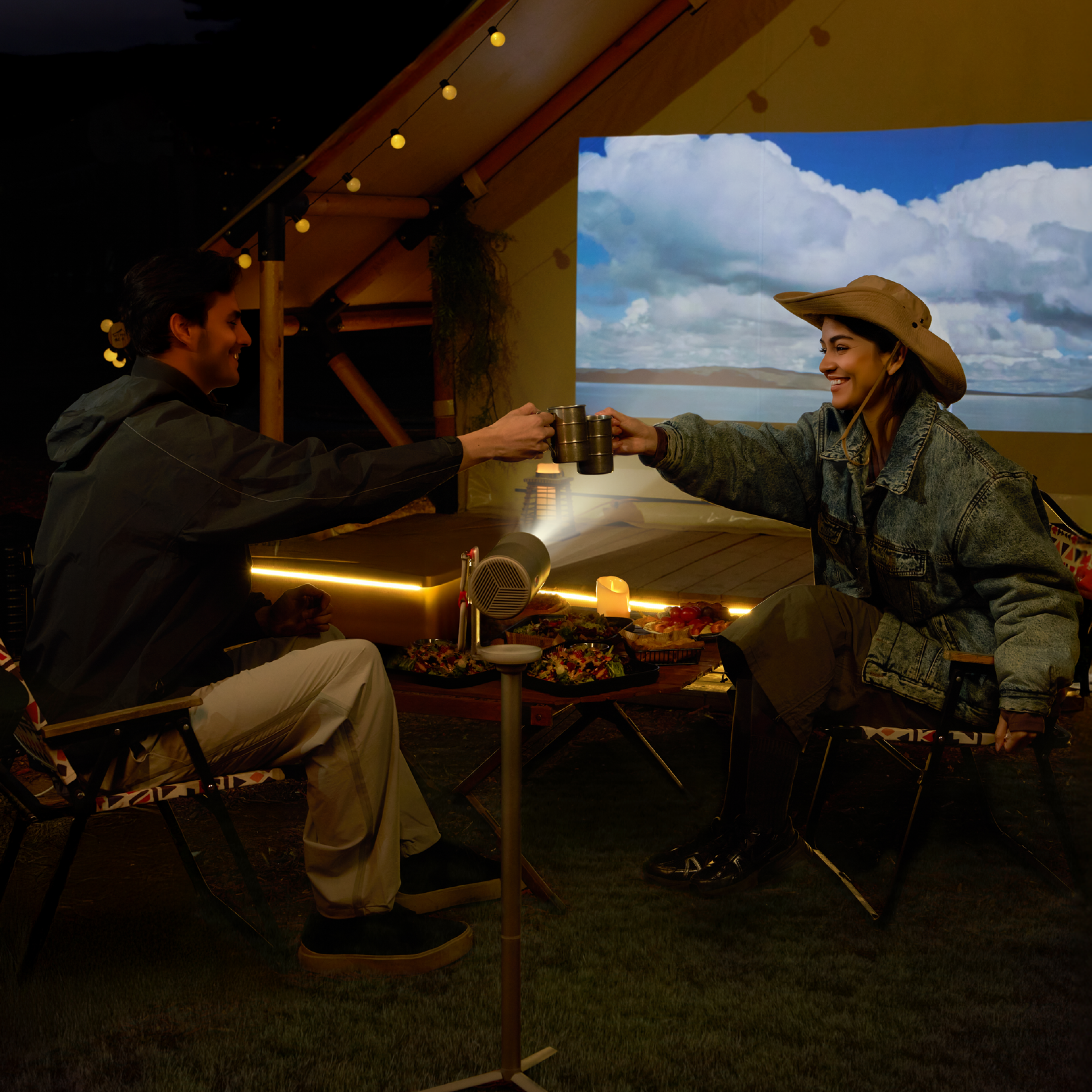 Compact XGIMI projector and battery-powered floor stand set for long-lasting movie nights anywhere
